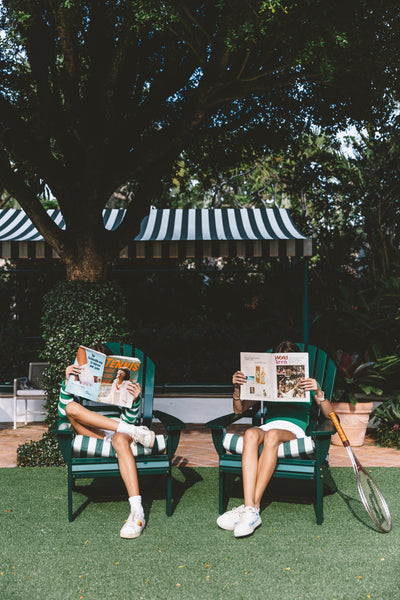 girls reading vintage tennis magazines