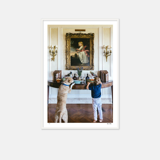 boy and dog at console table taking food. 