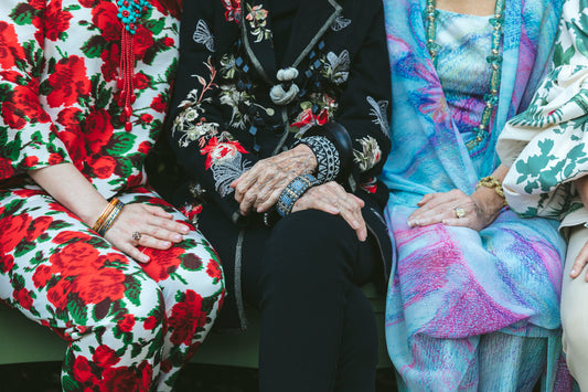 grand hands three women jewelry floral prints