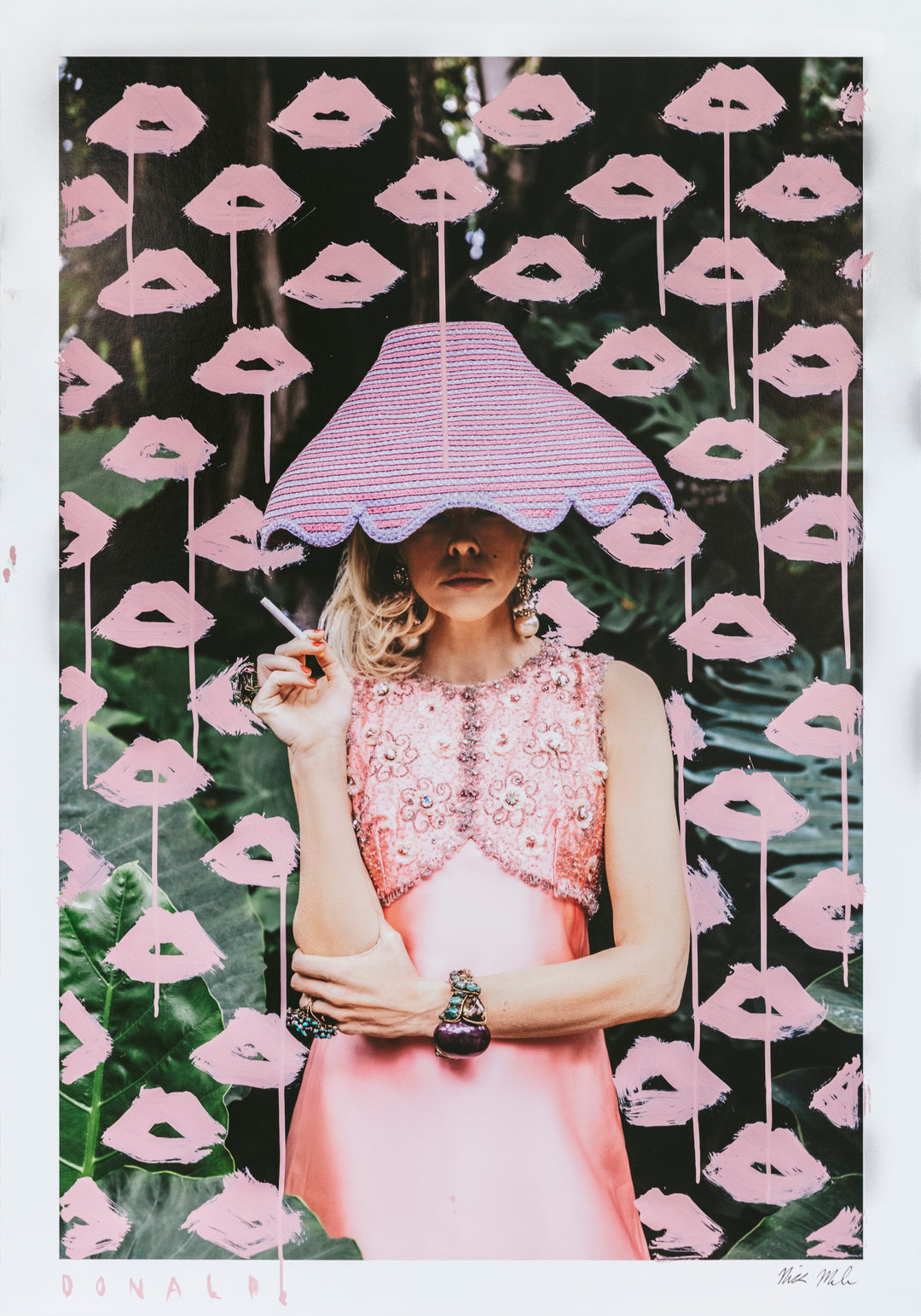 Woman in a pink dress holding a cigarette under a striped umbrella against a background of pink lips.