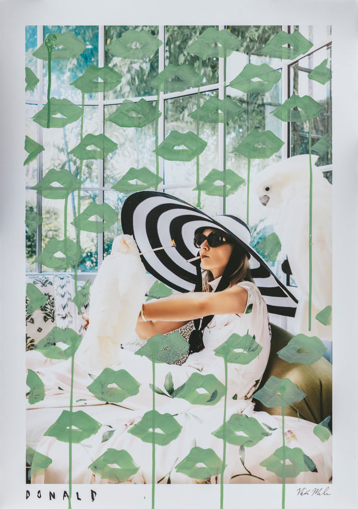 Woman with a black and white umbrella sitting on a bench with a white dog, surrounded by green leaf patterns.