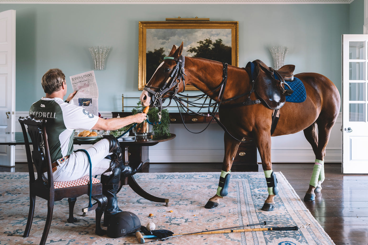 horse in dining room being fed a carrot