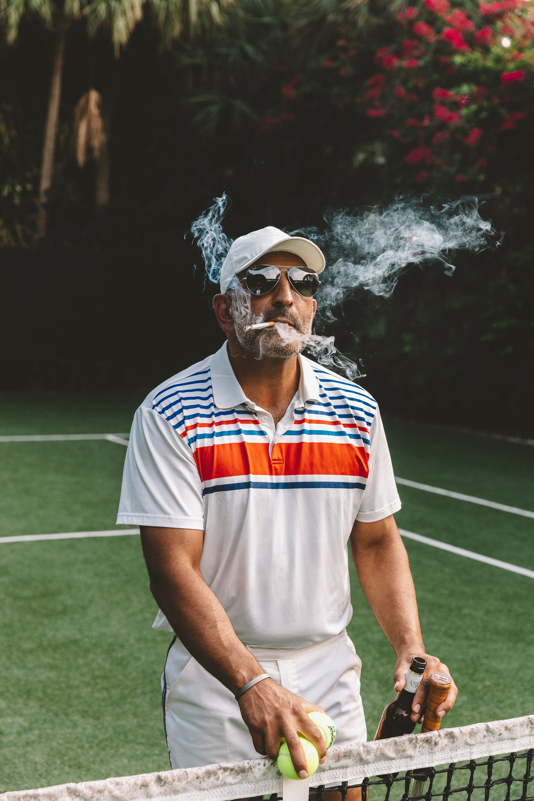 tennis pro smoking on tennis court