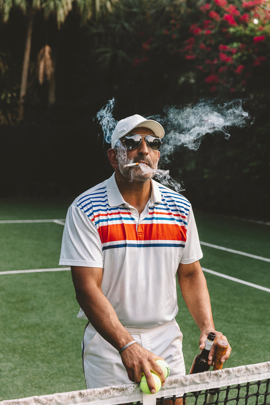 tennis pro smoking on tennis court