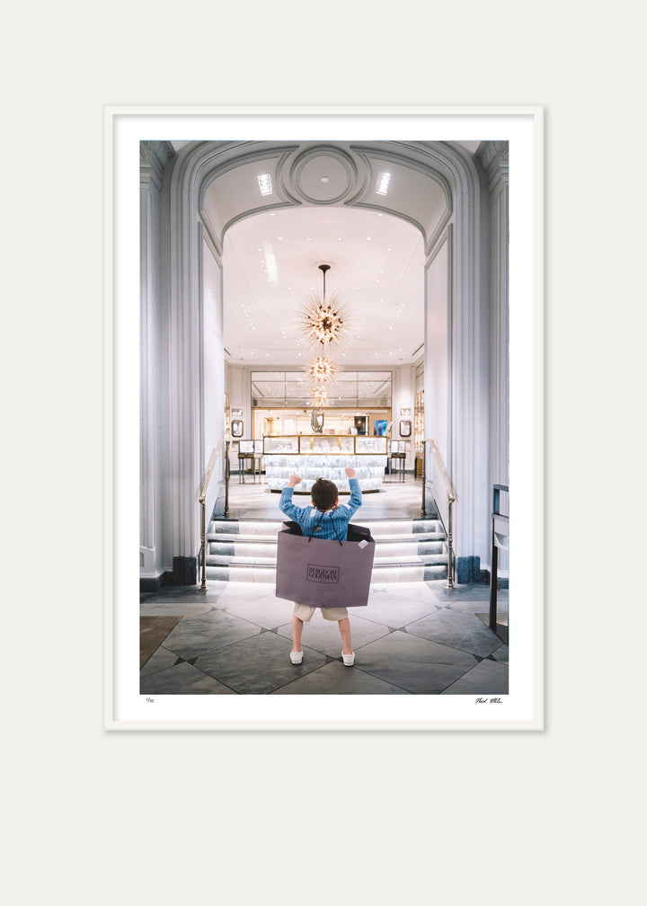 Girl in a veiled hat tries on platform heels among scattered shoe boxes. Nick Mele x Bergdorf Goodman, A New York Affair