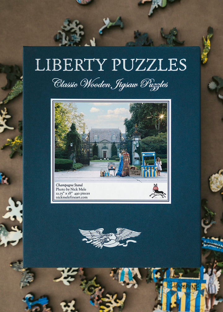 Liberty Puzzles box for Champagne Stand by Nick Mele, a 490-piece wooden jigsaw, on scattered whimsy pieces